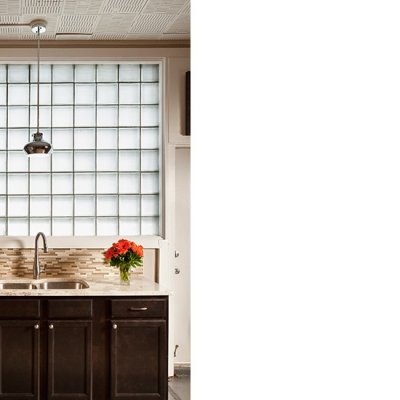 view of a kitchen sink and cabinets